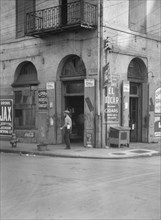 Exterior of Court House Grocer, New Orleans, between 1920 and 1926. Creator: Arnold Genthe.