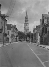 View down street to St. Philip's Church, Charleston, South Carolina, between 1920 and 1926. Creator: Arnold Genthe.
