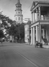 View down street to St. Michael's Church, Charleston, South Carolina, between 1920 and 1926. Creator: Arnold Genthe.