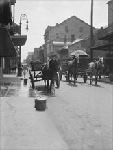 View down a street, New Orleans or Charleston, South Carolina, between 1920 and 1926. Creator: Arnold Genthe.