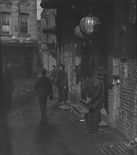 Doorways in dim shadows, Chinatown, San Francisco, between 1896 and 1906. Creator: Arnold Genthe.