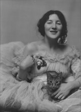 Miss Audrey Munson, with Buzzer the cat, portrait photograph, 1915 Mar. 23. Creator: Arnold Genthe.