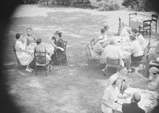 Mrs. Mary Benson and others, seated outdoors, between 1933 and 1942. Creator: Arnold Genthe.