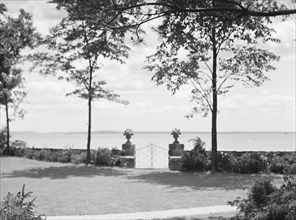 Garden overlooking water, East Hampton, Long Island, between 1933 and 1942. Creator: Arnold Genthe.