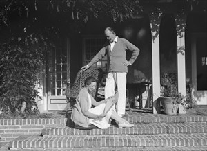 Mr. and Mrs. Hamilton King seated on the steps of their house, between 1911 and 1934. Creator: Arnold Genthe.