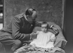 Lieutenant H.B. Stimson and baby, portrait photograph, 1918 May 8. Creator: Arnold Genthe.