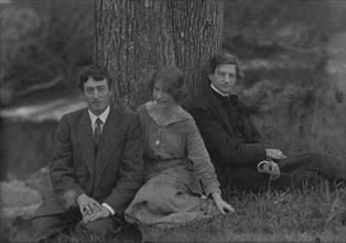Millay, Edna St. Vincent, Miss, with Bliss Carman and George Sterling, seated against a tree, 1914. Creator: Arnold Genthe.