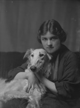 Wessell, Miss (Mrs. A.L. Cochrane), or Mrs. Meyer D. Rothchild, with dog, portrait..., 1916 or 1917. Creator: Arnold Genthe.