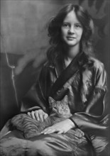 Stebbins, Jocelyn, Miss (Mrs. Fletcher), and Buzzer the cat, portrait photograph, 1912 or 1913. Creator: Arnold Genthe.