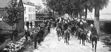'L'aide Francaise a la Belgique; nos escadrons ont pris contact avec la cavalerie allemande', 1914.. Creator: Unknown.
