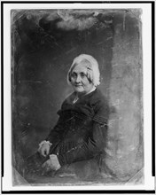 Unidentified woman, half-length portrait, three-quarters to the left..., between 1851 and 1860. Creator: Mathew Brady.