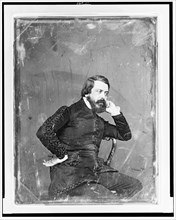 Unidentified man, three-quarter length portrait, three-quarters to the..., between 1844 and 1860. Creator: Mathew Brady.