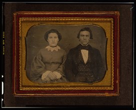 Unidentified man and woman, half-length portrait, seated, ca. 1855. Creator: Francis Grice.
