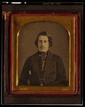 Unidentified man, half-length portrait, seated, facing front, between 1848 and 1860. Creator: Montgomery Simons.