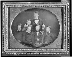 William Cassiday [sic] Cattell, holding large Bible, with five page boys, between 1848 and 1860. Creator: Unknown.