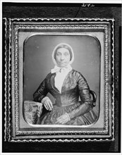 Jerusha Field, half-length portrait, seated in chair, with arm resting..., between 1840 and 1860. Creator: Unknown.