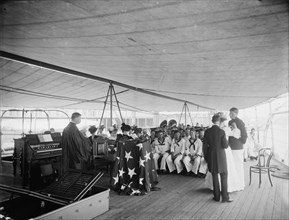 U.S.S. Texas, presentation of cross and badge to Ensign Gherardi by the King's..., Aug. 8, 1897. Creator: Unknown.