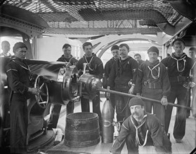 U.S.S. New York, breech of 8 inch gun and crew, between 1893 and 1901. Creator: William H. Jackson.