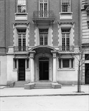 Four-story townhouse, entrance with pilasters and curved pediment, possibly New York, c1900-1905. Creator: William H. Jackson.