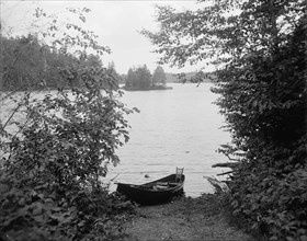 Glimpse of Upper St. Regis Lake, Adirondack Mtns., N.Y., between 1900 and 1910. Creator: Unknown.