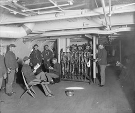 U.S.S. Brooklyn, group on gun deck, between 1896 and 1899. Creator: Unknown.