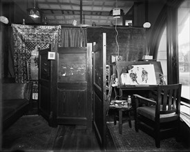 Office, furnishings and artist easel at Mulford & Petry Co., Detroit, Mich., between 1900 and 1910. Creator: Unknown.