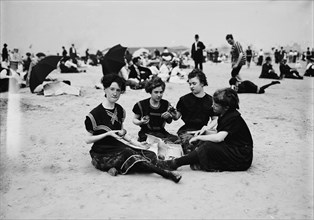 Picnicing on the beach, between 1900 and 1905. Creator: Unknown.
