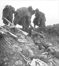 'Dans les Hauts-de-Meuse; nos hommes retirent, les cadavres allemands', 1915. Creator: Unknown.