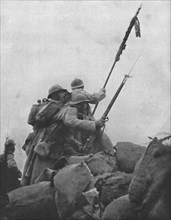'Le drapeau a l'attaque; Le colonel desgrees du lou dressant, sous la mitraill...1915 (1924). Creator: Unknown.