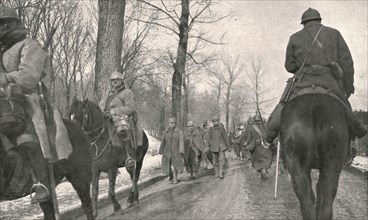 'Verdun; Apres l'attaque: 68 Allemands, pris au bois des Caures, entrent a Verdun...1916', 1924) Creator: Unknown.