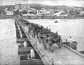'Le Portugal dans la guerre; Artillerie portugaise traversant le pont militaire de..., 1916 (1924) Creator: Unknown.