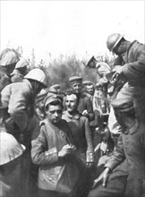 'Pendant l'action; Les premiers prisonniers du premier jour: de tres jeunes gens', 1916 (1924) Creator: Unknown.
