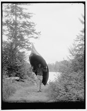 An Adirondack carry, c1902. Creator: William H. Jackson.