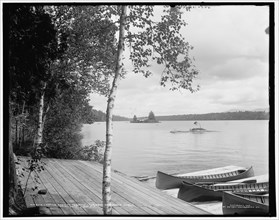 Looking east on Raquette Lake from St. Hubert's Isle, Adirondack Mountains, c1902. Creator: William H. Jackson.