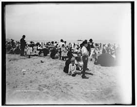On the beach at Coney Island, between 1901 and 1906. Creator: Unknown.