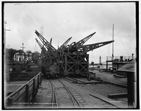 Unloading ore from whaleback, Buffalo, c1900. Creator: Unknown.
