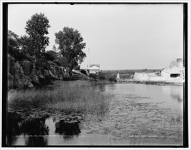 Racine, Wis., Root River rapids, old cement mills, between 1880 and 1899. Creator: Unknown.