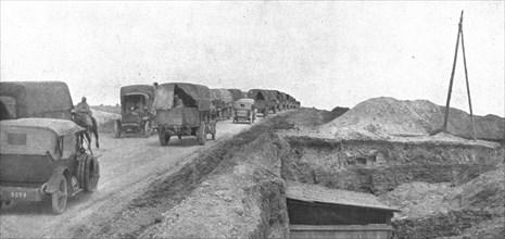 'Au Volant; Une route du front: arrivee des convois dans la zone avancee', 1918. Creator: Unknown.