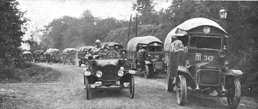 'Au Volant; convoi d'autos-camions menes par des conducteurs indo-chinois, sous..., 1918. Creator: Unknown.