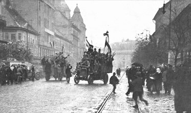 ''La Chute des Habsbourg; Camions automobiles charges de soldats revolutionnaires circulant..., 1918 Creator: Emery Revesz-Biro.