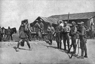 'Ramenés au Devoir; Deserteurs repentis barrant une route pour arreter a leur tour de..., 1917. Creator: Unknown.