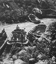 Italian Offensive of the Isonzo; boats are launched into the current slowed down by a dam, 1917. Creator: Unknown.