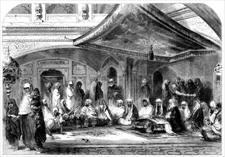 Interior of a Sikh Temple at Umritzir - reading the Grunt'h, 1858. Creator: Unknown.