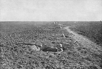 'Dans la Bataille; A la guerre de tranchee a succede, pour un temps, la guerre de trous..., 1918. Creator: Unknown.