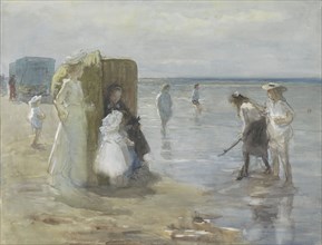 View along the tide line on Scheveningen beach, with women and children, 1874-1927. Creator: Johan Antonie de Jonge.