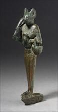 Figurine of Standing Cat Headed Goddess with Sistrum, Probably Ptolemaic Period (332-30 BCE). Creator: Unknown.