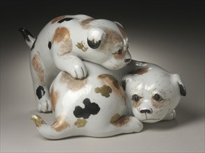 Okimono in the Form of a Pair of Gamboling Piebald Puppies, 19th century. Creator: Unknown.