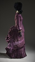Woman’s 2-piece silk bustle dress, France, c.1885. Creator: Unknown.
