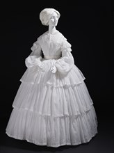 Woman's white muslin dress with tiered flounces, Europe, c.1855. Creator: Unknown.