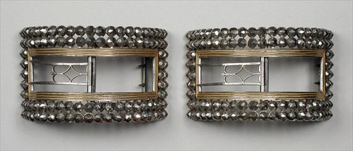 Pair of man’s steel and gilt wire shoe buckles, England, c.1777 and c.1785. Creator: Unknown.